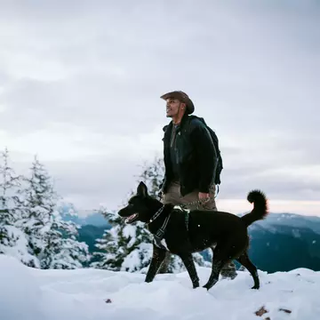 An African American man and his dog hiking in the snow covered mountain areas of Washington state, USA.  An exciting winter adventure.
CLEARED FOR DIGITAL USE ONLY -