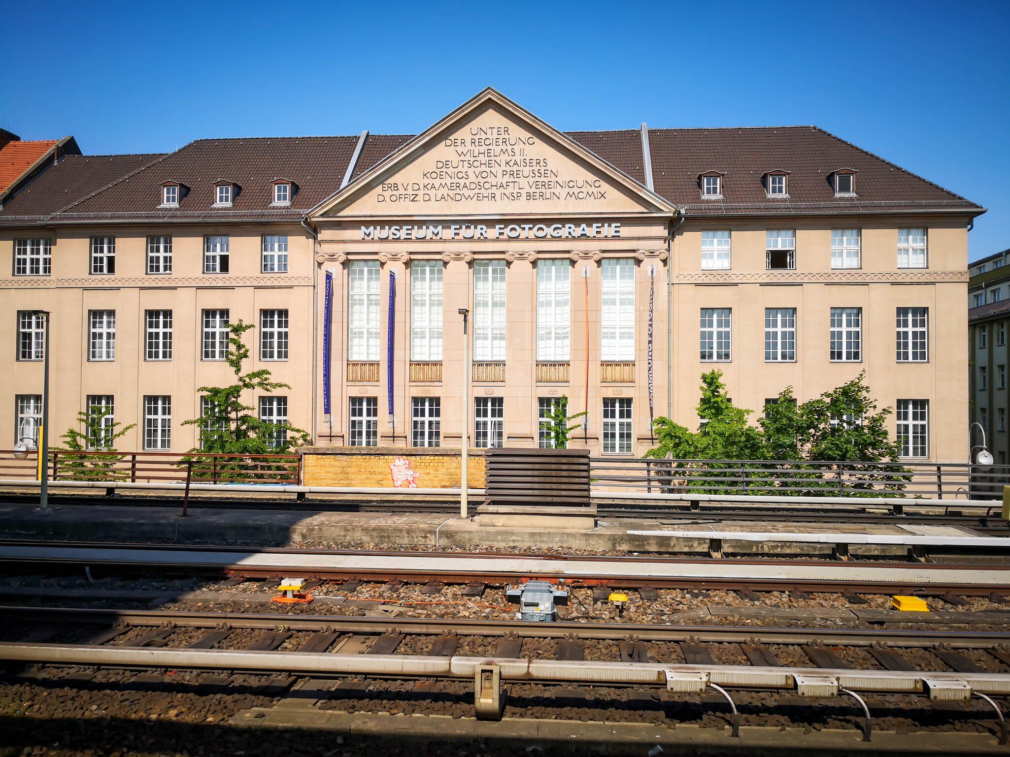 Facade of the Museum of Photography (Museum für Fotografie) in Berlin with rails in front.