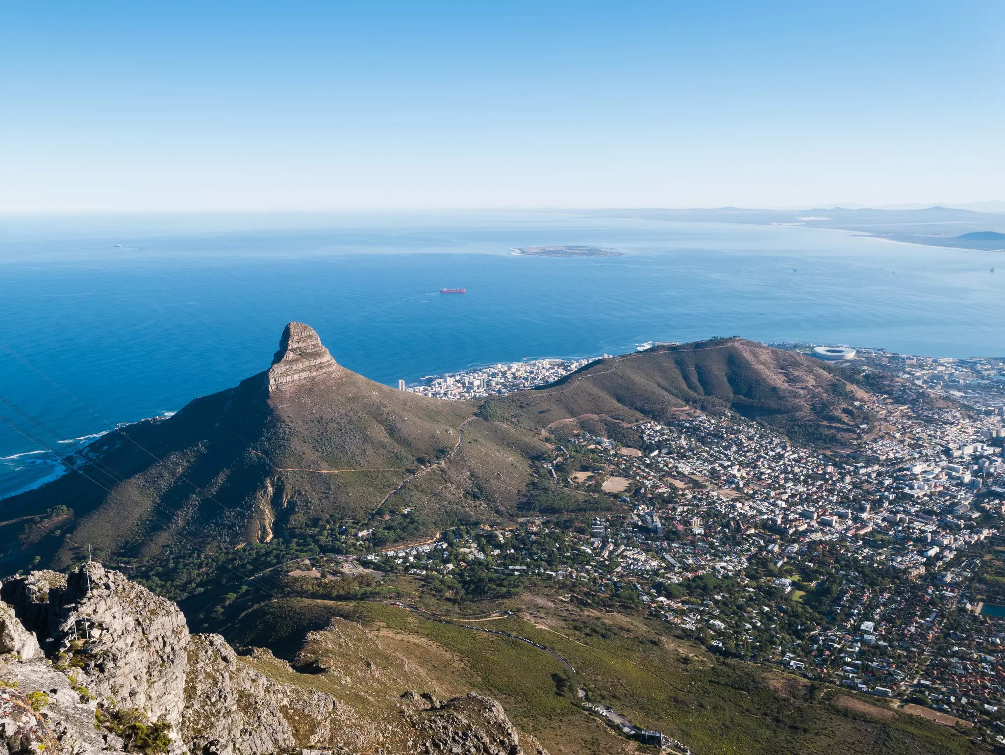 Lion's Head and Signal Hill as viewed from Table Mountain, with the blue ocean in the background