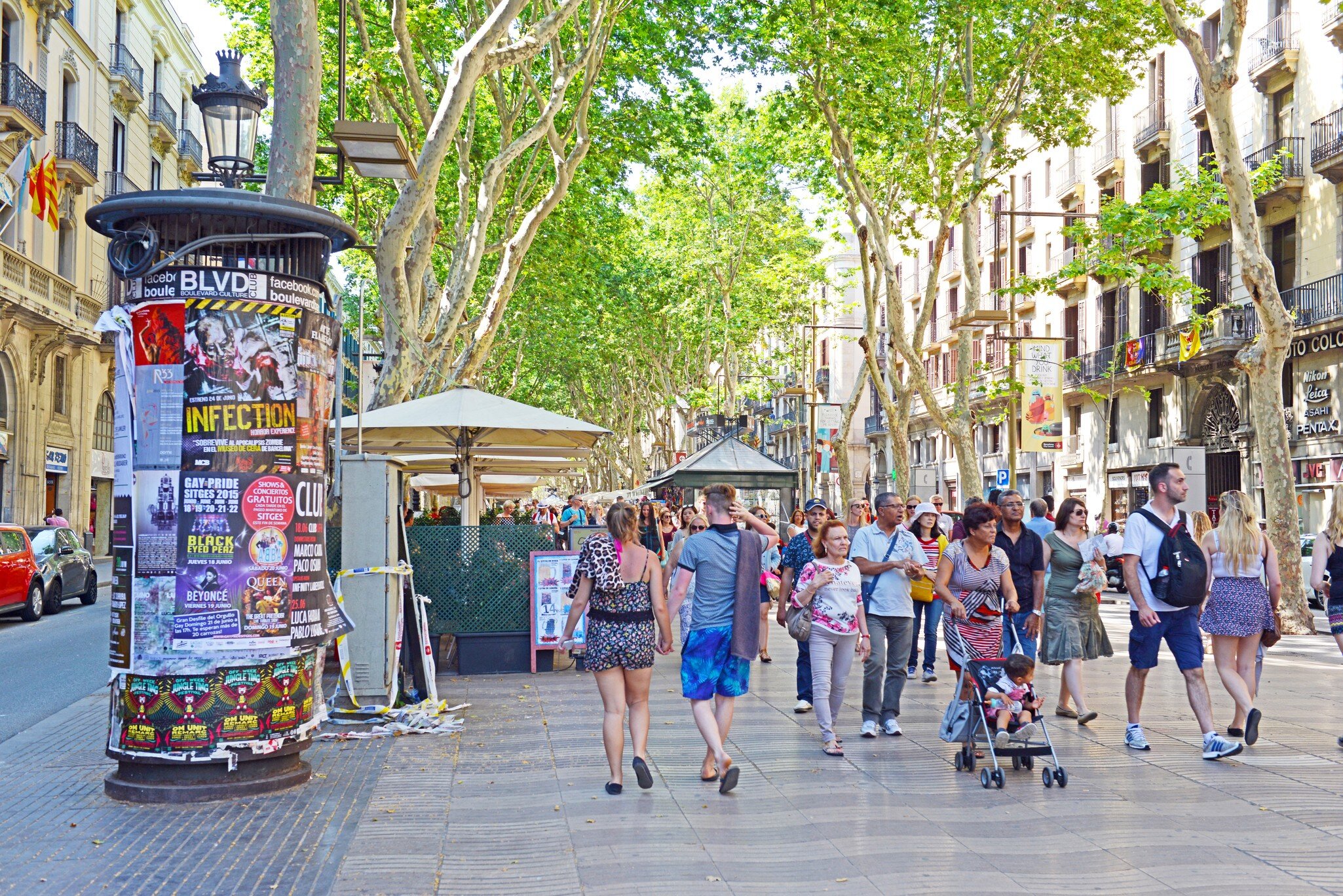 Barcelona, Spain - June 17, 2015: The always crowded, La Rambla in Barcelona is one of the more popular tourist draws to the city and is always filled with interesting characters and vendors.