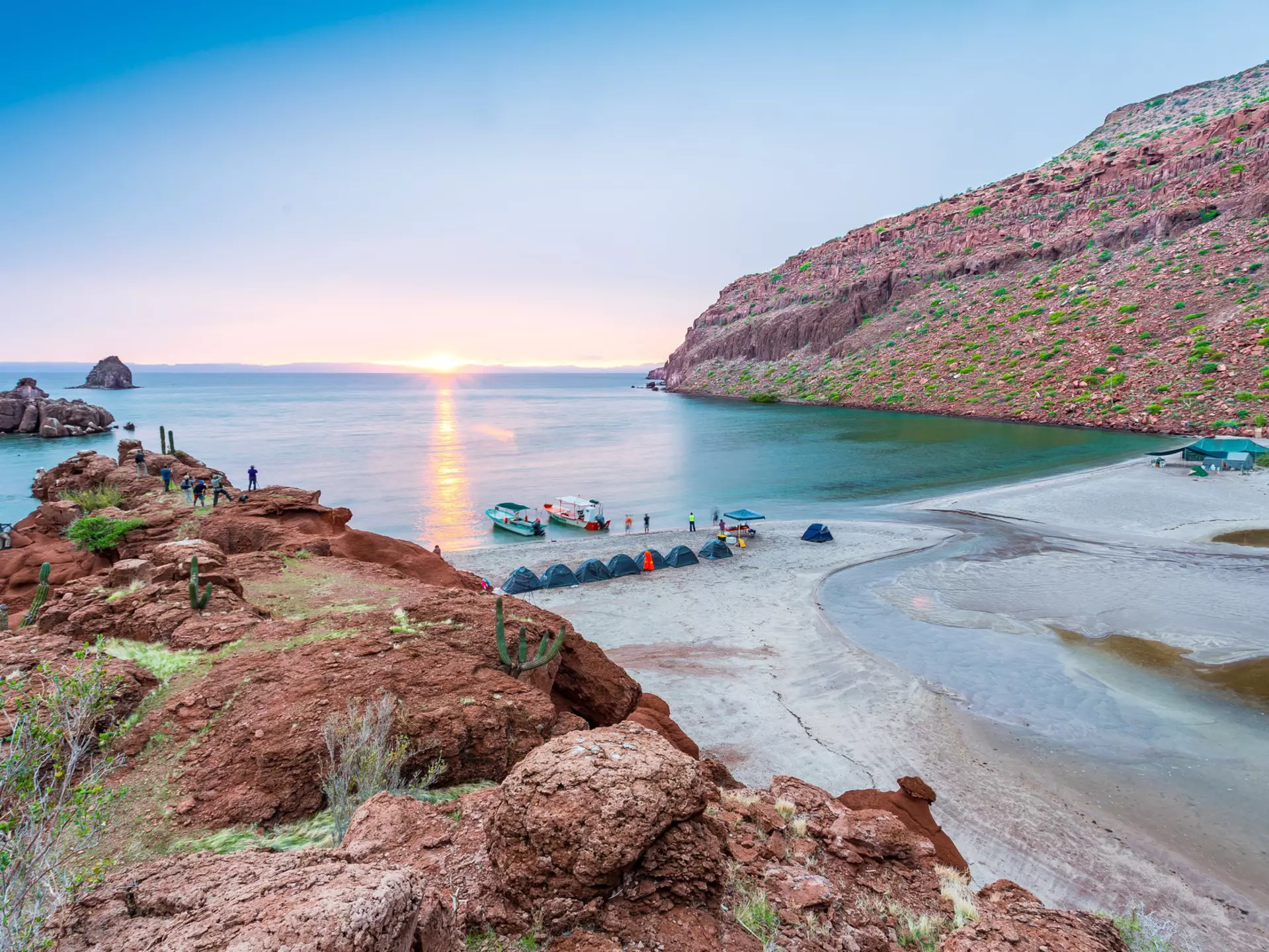 Camping on the beach at Espiritu Santo at sunset. MIGUEL ZETTER LOPEZ/Shutterstock
