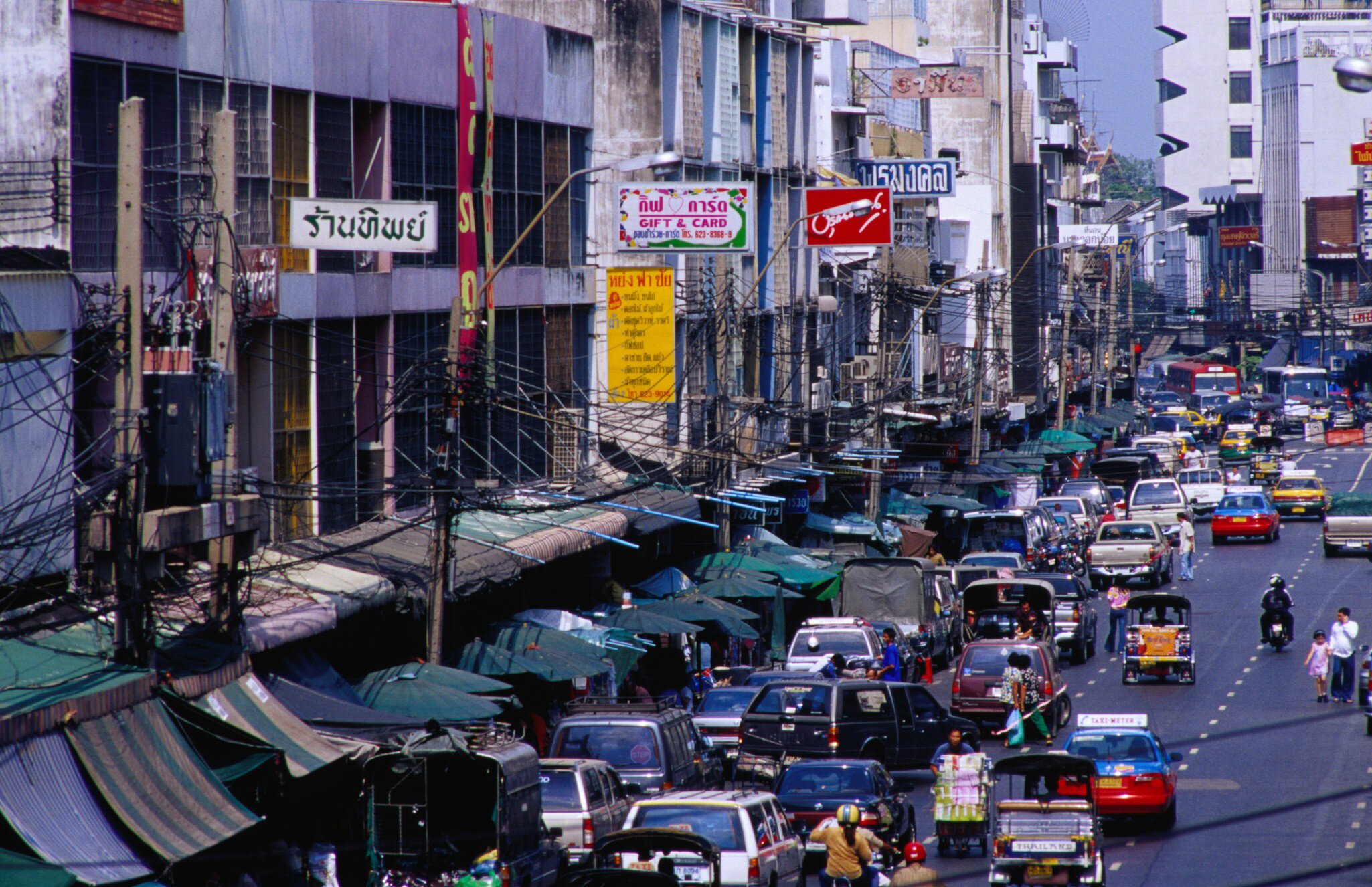 Traffic on Th Phahurat outside Phahurat Market.
12563-26
Asia, Bangkok, South-East Asia, Thailand, activity, architecture, awning, building, car, city, motor vehicle, motorbike, non-motorised vehicle, pedicab, sign, taxi, traffic sign, transport, urban, vehicle