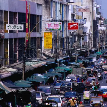 Traffic on Th Phahurat outside Phahurat Market.
12563-26
Asia, Bangkok, South-East Asia, Thailand, activity, architecture, awning, building, car, city, motor vehicle, motorbike, non-motorised vehicle, pedicab, sign, taxi, traffic sign, transport, urban, vehicle