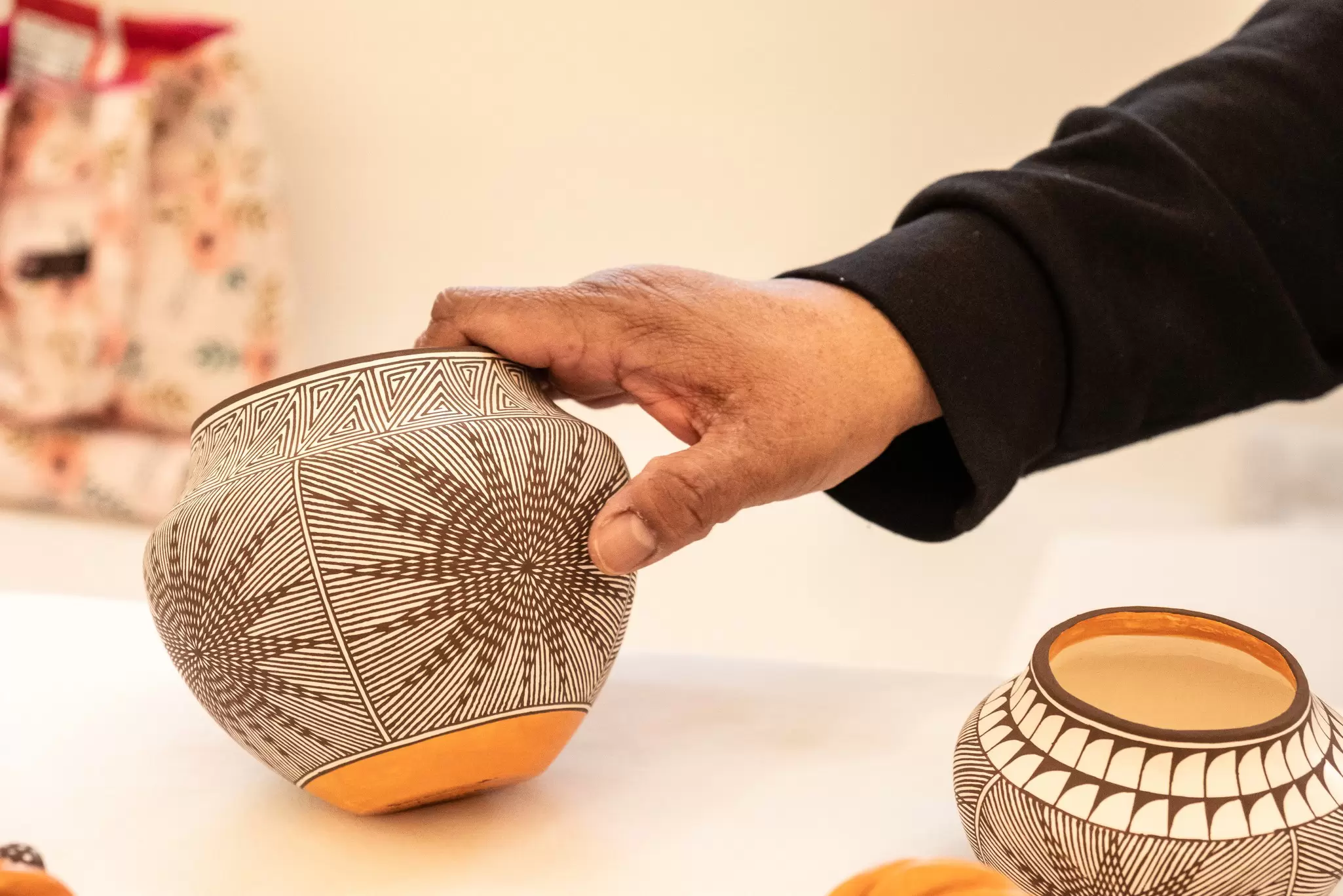 Acoma Pueblo potter Stephanie Patricio displays her intricate pottery