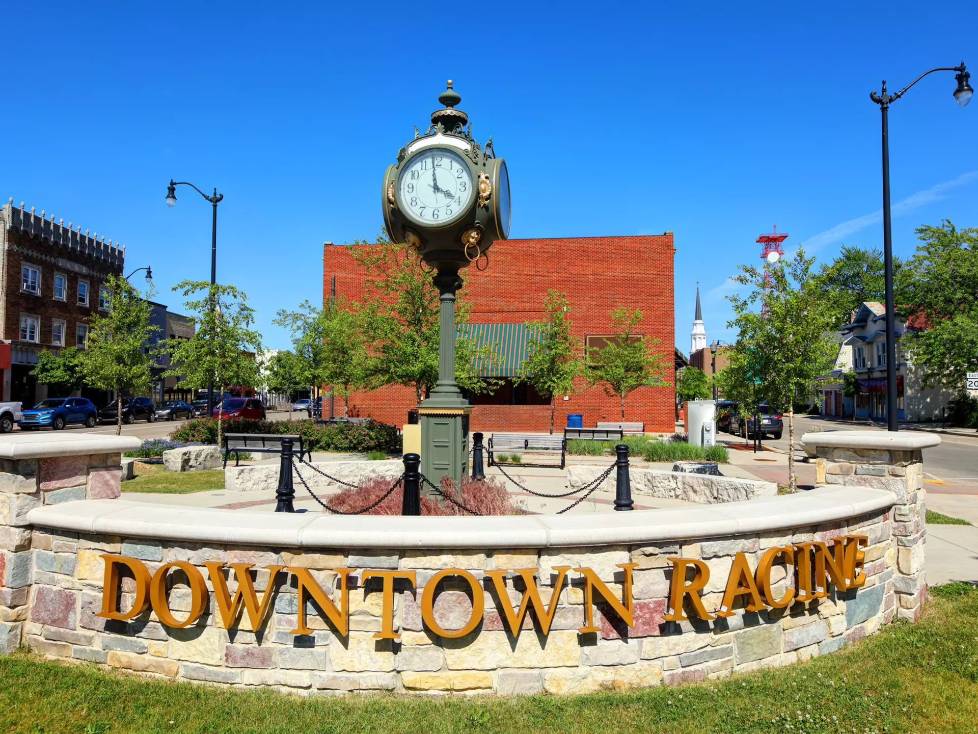 A sign that reads Downtown Racine in front of a small clock tower in Racine, Wisconsin