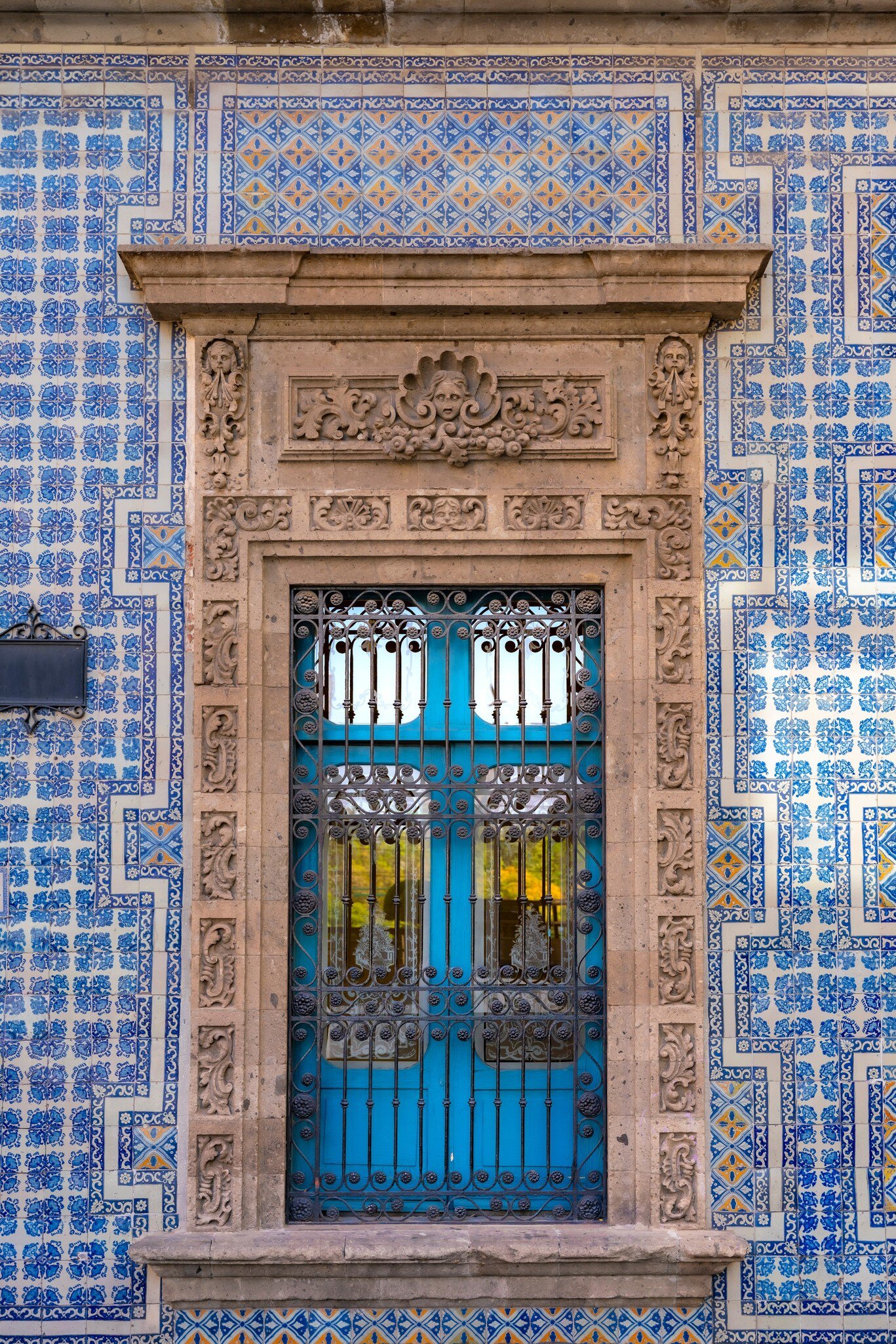 February 19, 2017: Part of the facade of La Casa de los Azulejos or Palacio de los Condes de Orizaba on a sunny day in Mexico City.