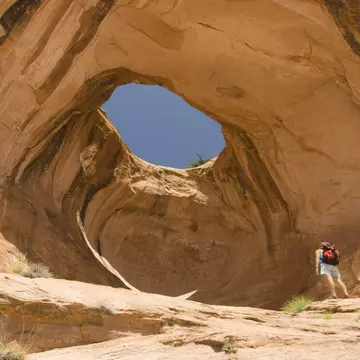 A hiker looks at Bowtie Arch outside of Moab, Utah.
83653942
active, adults, arch, color image, day, desert, exercise, hiker, hiking, horizontal, moab, one adult woman only, one person, outdoors, photography, recreation, slickrock, solitude, summer, trail, utah