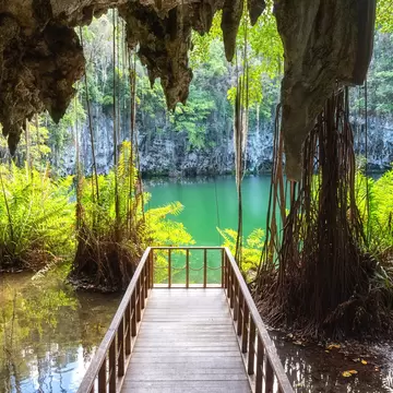 Three eyes cave in Santo Domingo, los Tres Ojos national park, Dominican Republic. Scenic view of limestone cave, beautiful lake and tropical plants, nature landscape, outdoor travel background  License Type: media  Download Time: 2023-08-21T08:47:19.000Z  User: claramonitto  Is Editorial: No  purchase_order:   