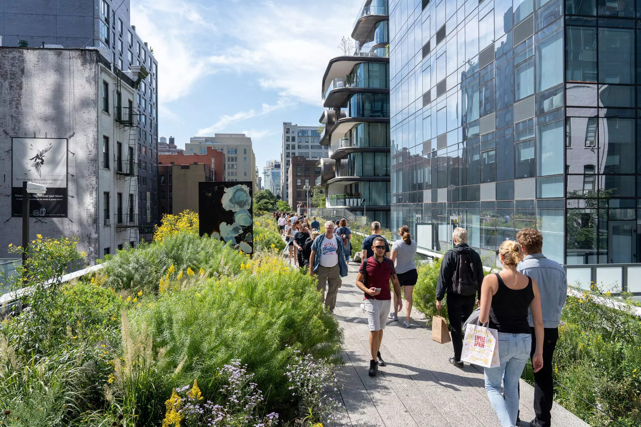 Visitors stroll along the High Line Park in Manhattan