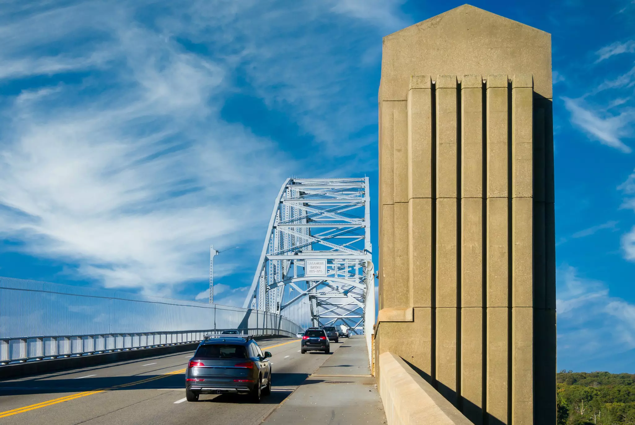 A steady stream of traffic crosses the Sagamore Bridge as it crosses the Cape Cod Canal leaving Cape Cod on a October afternoon.