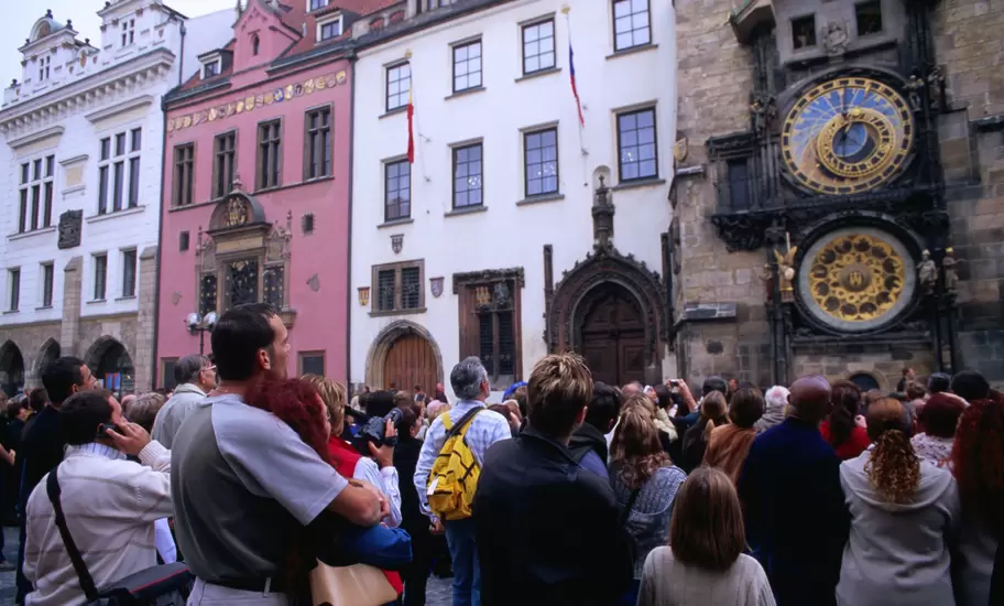 Tourists watching statues of the 12 apostles giving an hourly performance at Orloj (Old Town Hall).