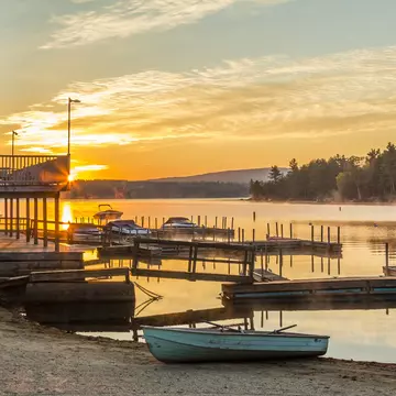 Boats on the shore at sunset at Lake Sunapee, New Hampshire