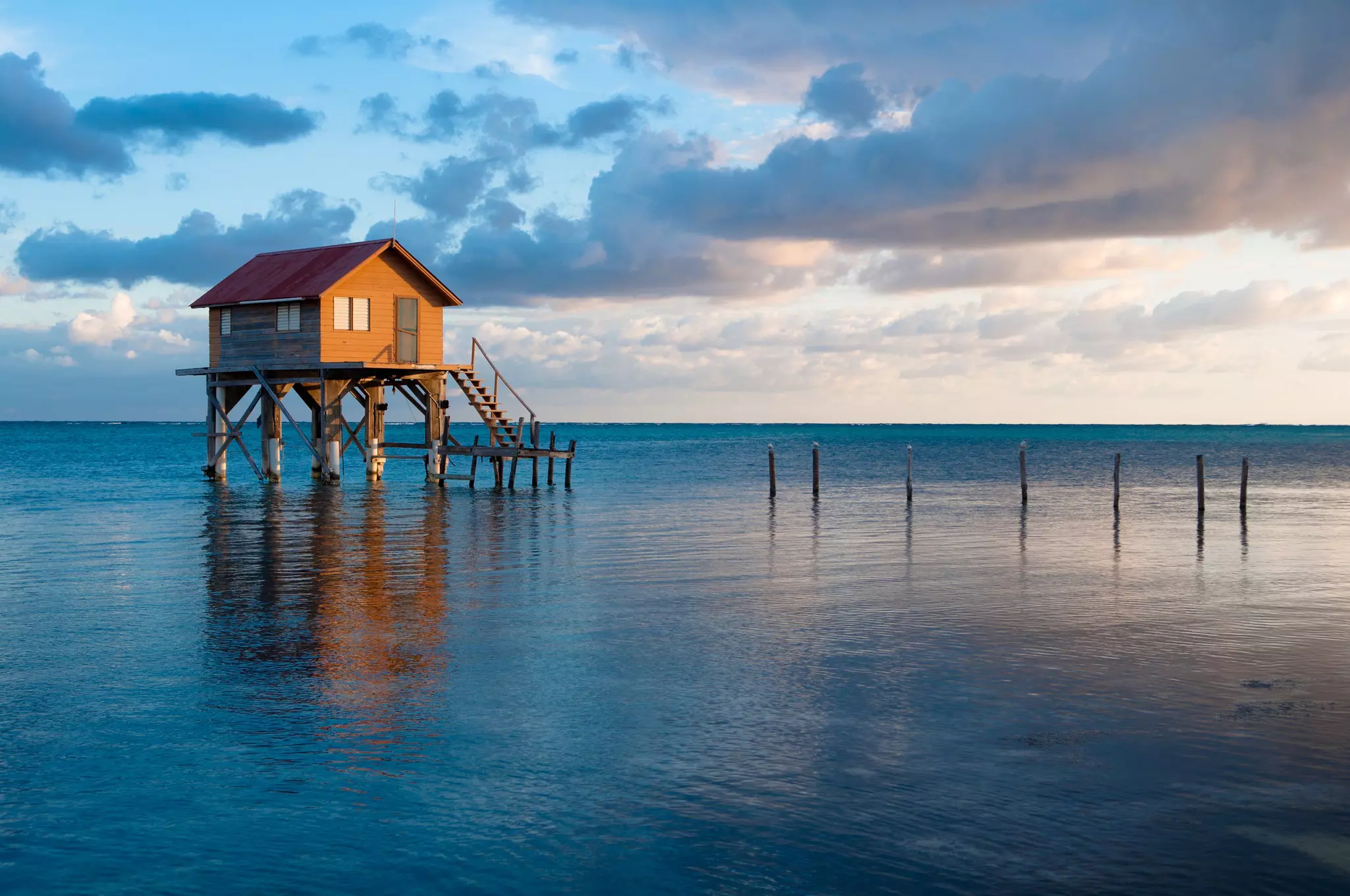 A structure on stilts in the blue sea.