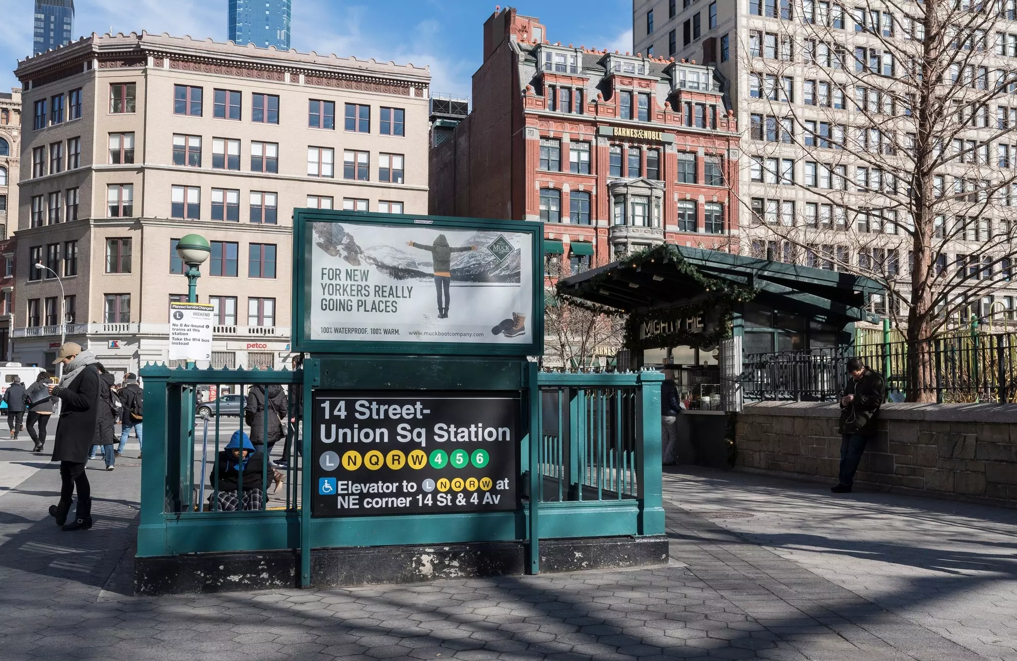 People around the entrance to 14th St Union Square subway station in New York City, USA.