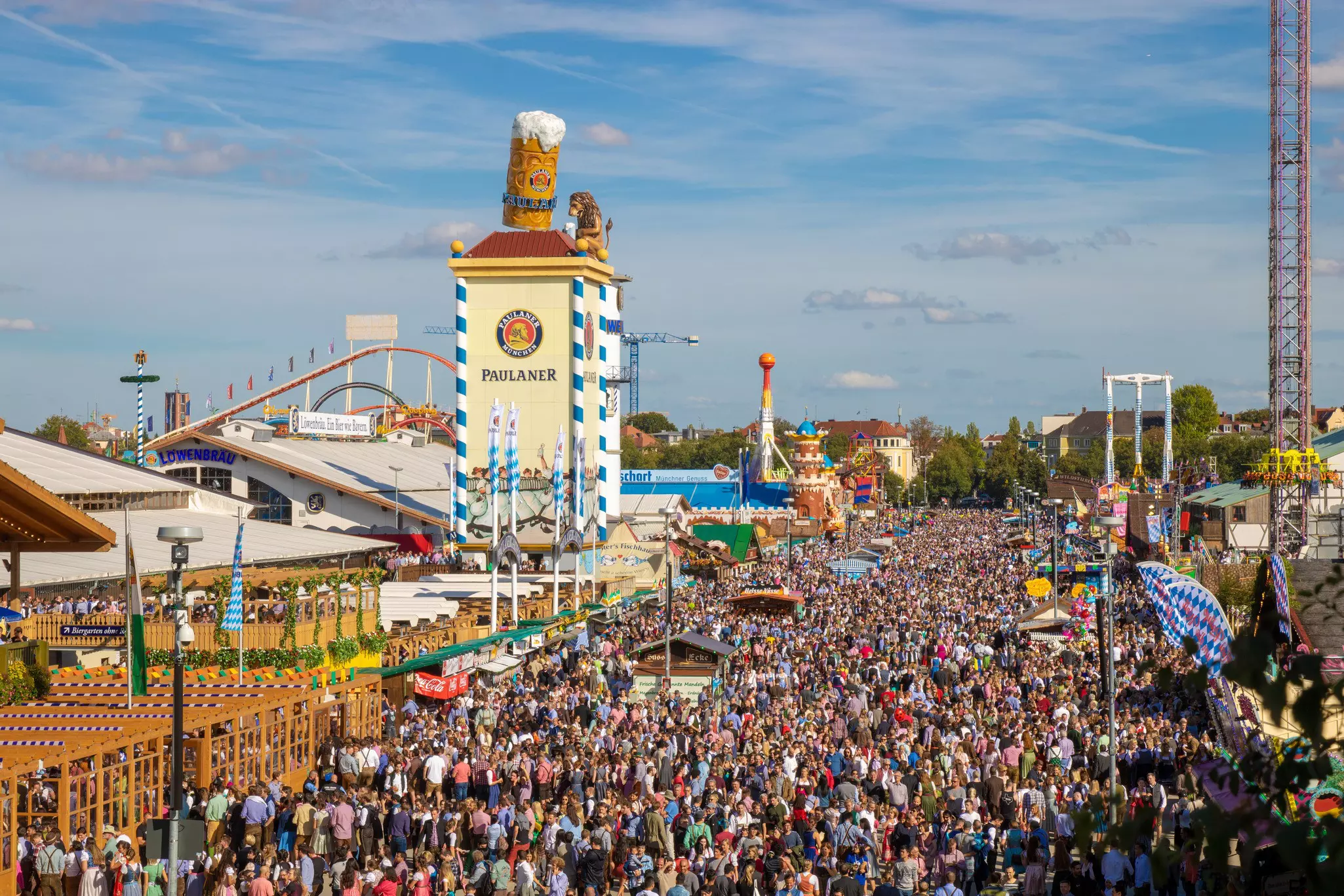Crowds of people at a beer festival on a sunny day