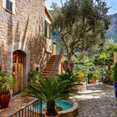 A picturesque street with stone buildings and cobblestone walkways.