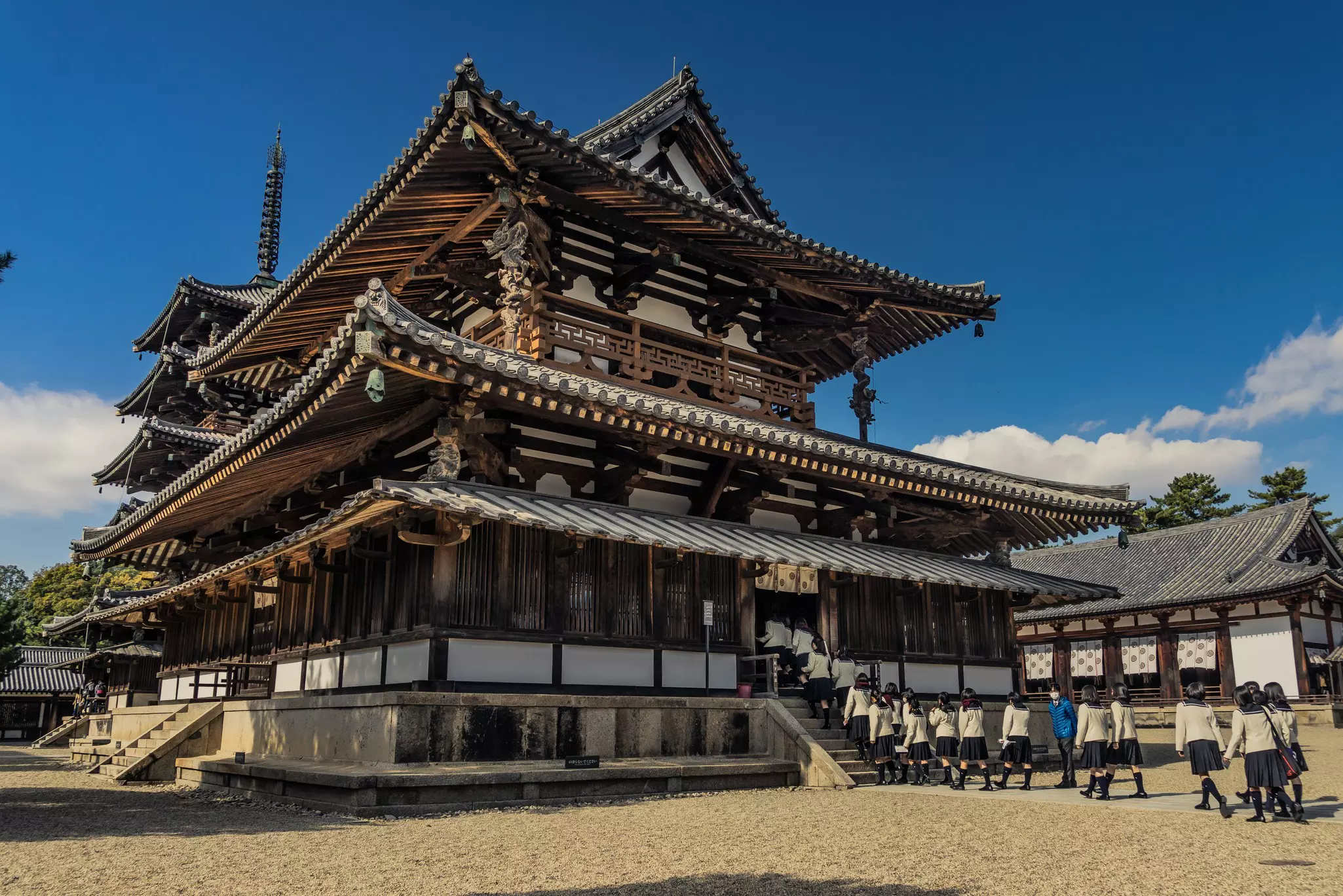 School girls on a field trip enter the Horyu-ji Temple.
1190461666
ancient, architecture, asia, asian, beautiful, blue, buddhism, buddhist, building, construction, culture, design, destination, heritage, historical, history, horyu, horyu-ji, horyuji, ikaruga, japan, japanese, ji, kansai, landmark, main, monument, nara, national, old, oriental, religion, religious, structure, temple, tourism, traditional, travel, unesco, vintage, wooden, world