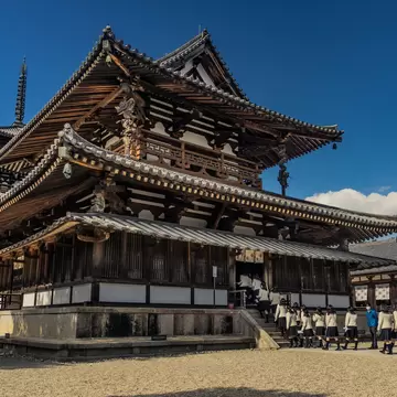 School girls on a field trip enter the Horyu-ji Temple.
1190461666
ancient, architecture, asia, asian, beautiful, blue, buddhism, buddhist, building, construction, culture, design, destination, heritage, historical, history, horyu, horyu-ji, horyuji, ikaruga, japan, japanese, ji, kansai, landmark, main, monument, nara, national, old, oriental, religion, religious, structure, temple, tourism, traditional, travel, unesco, vintage, wooden, world