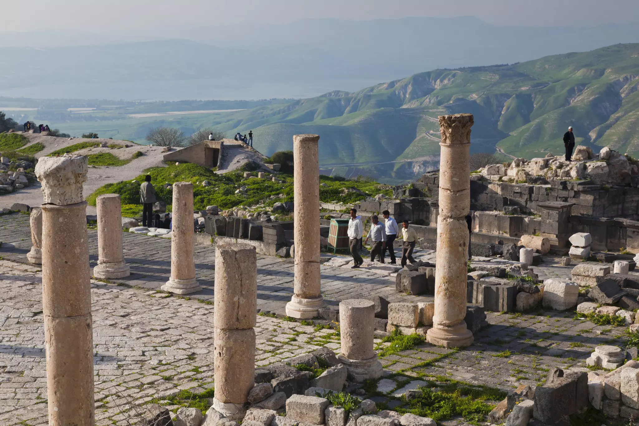 People walking around the ruins of the ancient Jewish and Roman city of Gadara at Umm Qais, Jordan.