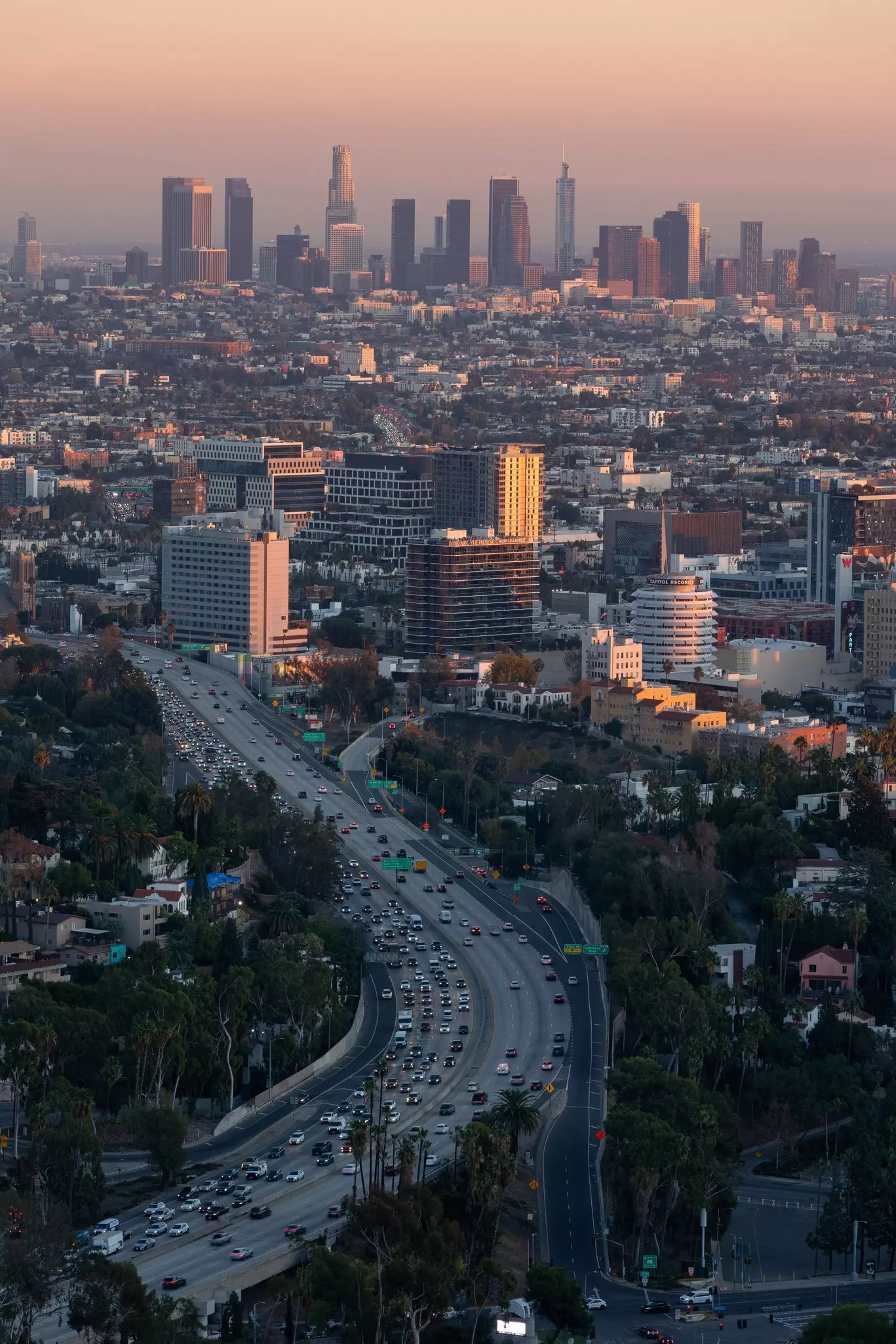 A freeway busy with cars leading to Downtown in Los Angeles, California, USA.