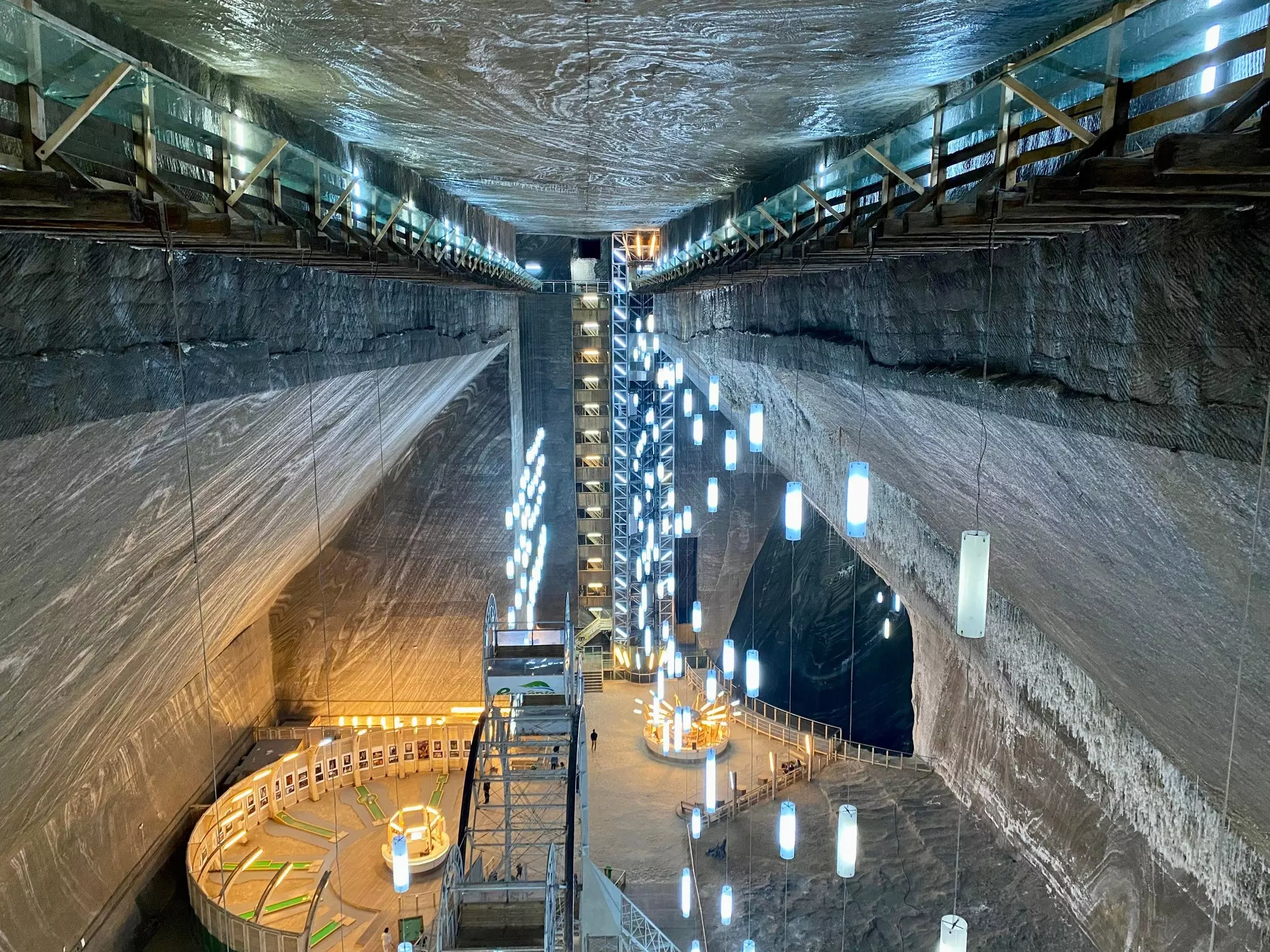 Lit up walkways inside the Turda Salt Mine in Romania