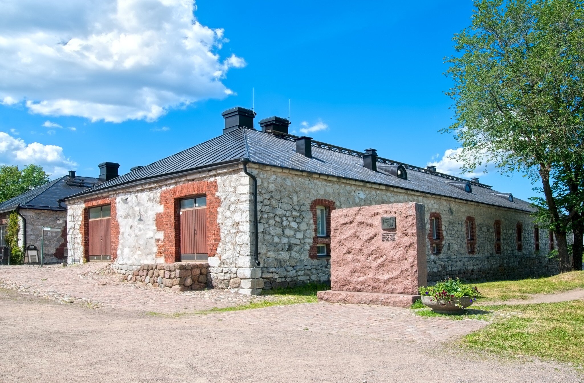 Lappeenranta, Finland - June 15, 2016: Monument for memory of  "Red finns"  shot here in 1918-19 and South Karelia Museum in Lappeenranta Fortress (Villmanstrand). Located in historical part of town.