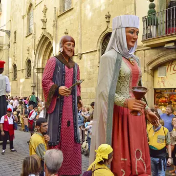 Colourful giants parading through La Rambla during La Mercè festival. mstepanphotographer / Shutterstock