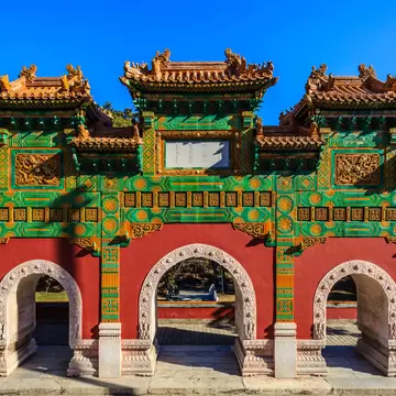 Temple of Zhao memorial archway surrounded by trees and blue sky