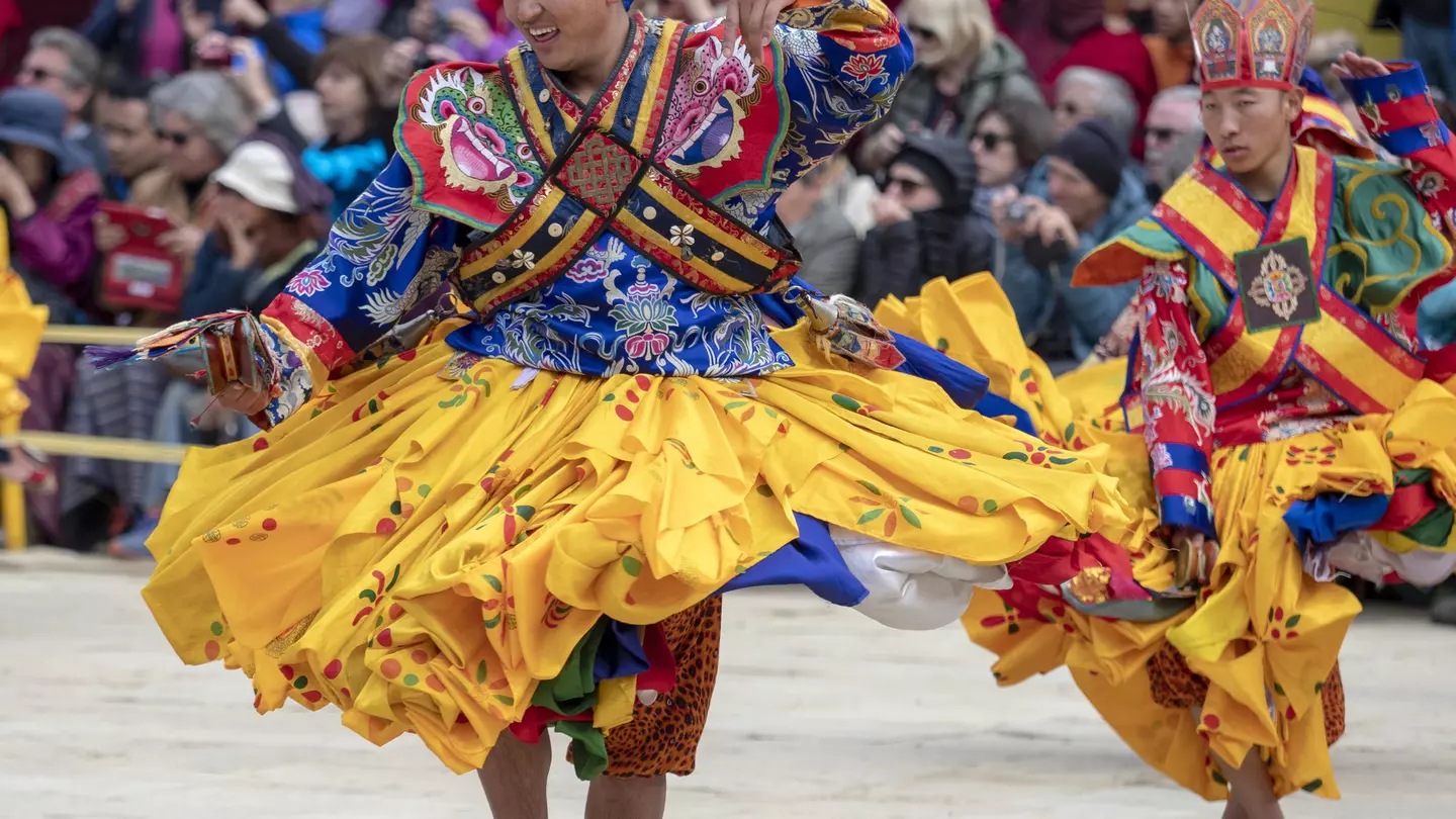 ancers at the Gangtey Monastery in the Phobjikha Valley, Bhutan, performing in the Black-Necked Crane festival, held annually to celebrate the return of the Black-Necked Cranes from their breeding grounds in Tibet