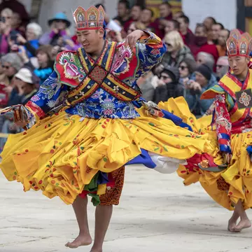 ancers at the Gangtey Monastery in the Phobjikha Valley, Bhutan, performing in the Black-Necked Crane festival, held annually to celebrate the return of the Black-Necked Cranes from their breeding grounds in Tibet