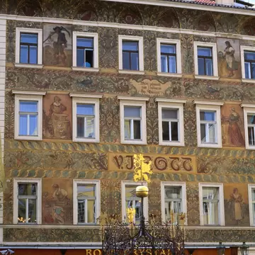 The facade of the VJ Rott building and well in Male Square in Prague, Czechia.
