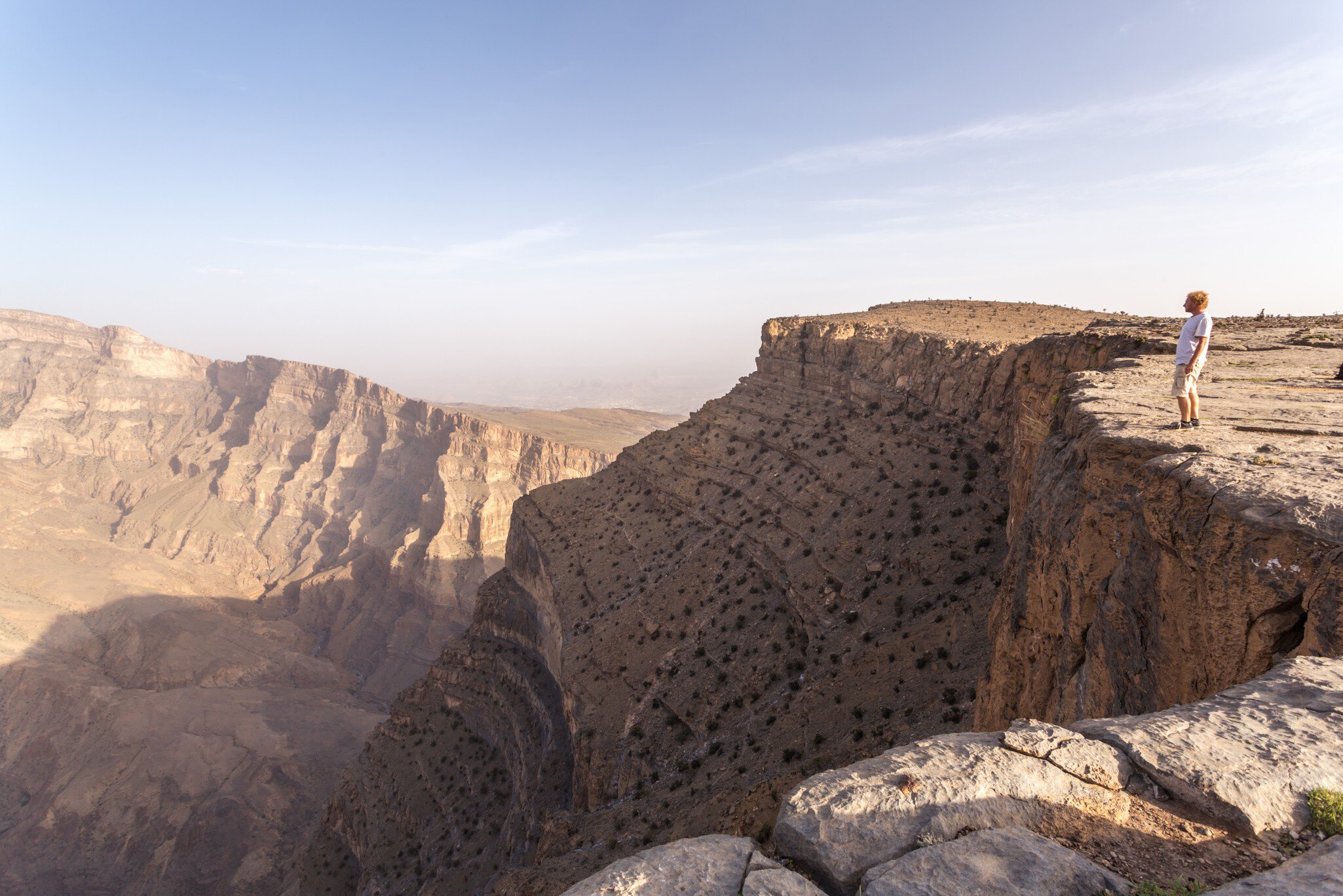 Man standing on the edge of Jebel Akhdar canyon
