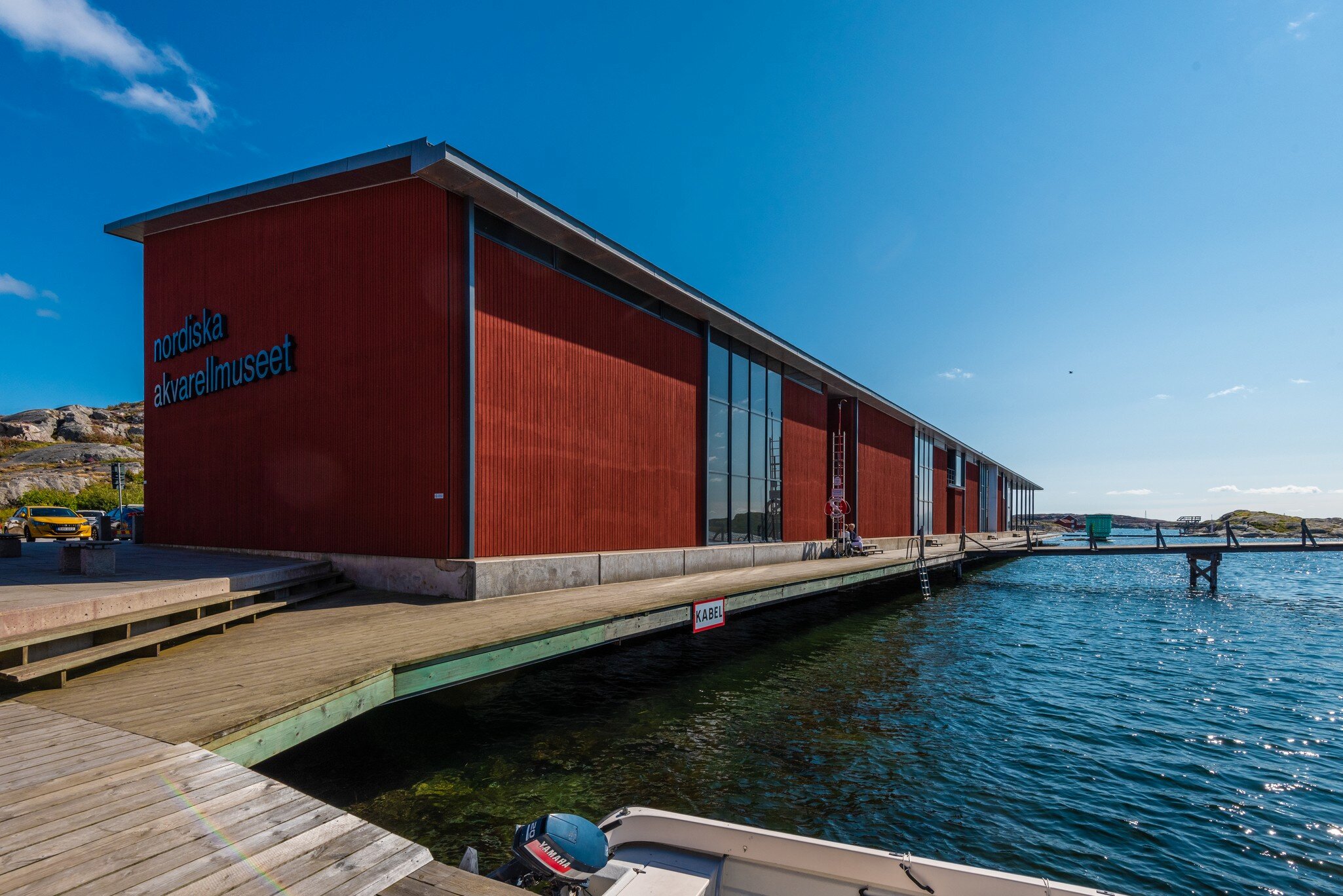 Exterior view of the Nordiska Akvarellmuseet by the water on a sunny day at Skärhamn in Tjörn, Sweden.