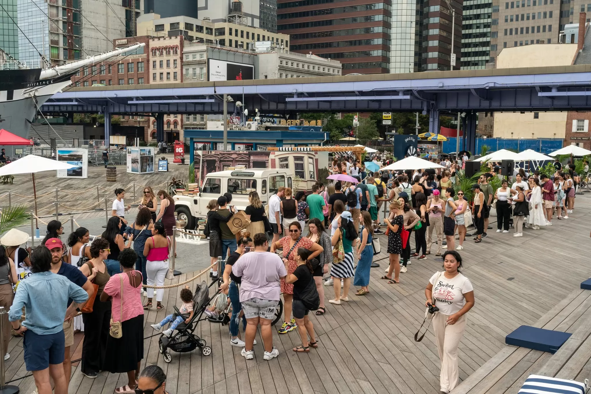 People flock to the South Street Seaport, New York.