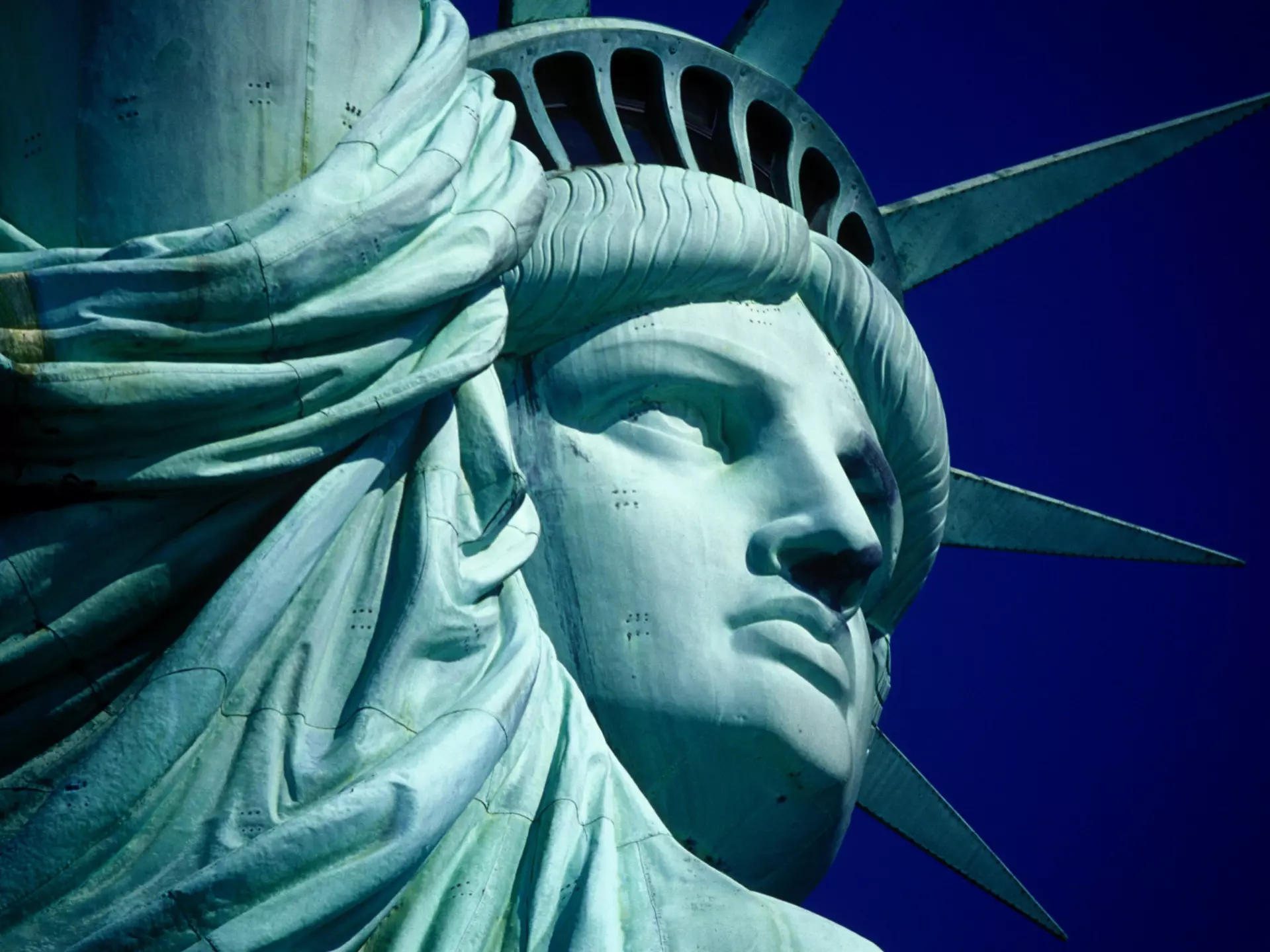 Cropped Image Of Statue Of Liberty Against Clear Blue Sky
534570599
American Culture; Blue; Freedom; New York City; No People; Statue; Statue Of Liberty; Clear Sky; Horizontal; Human Representation; Outdoors; Part; Part Of; Travel; Travel Destinations; UNESCO World Heritage Site; Close-up; Color Image; Crown; International Landmark; Photography; USA; Day; Famous Place; Female Likeness; Sculpture;