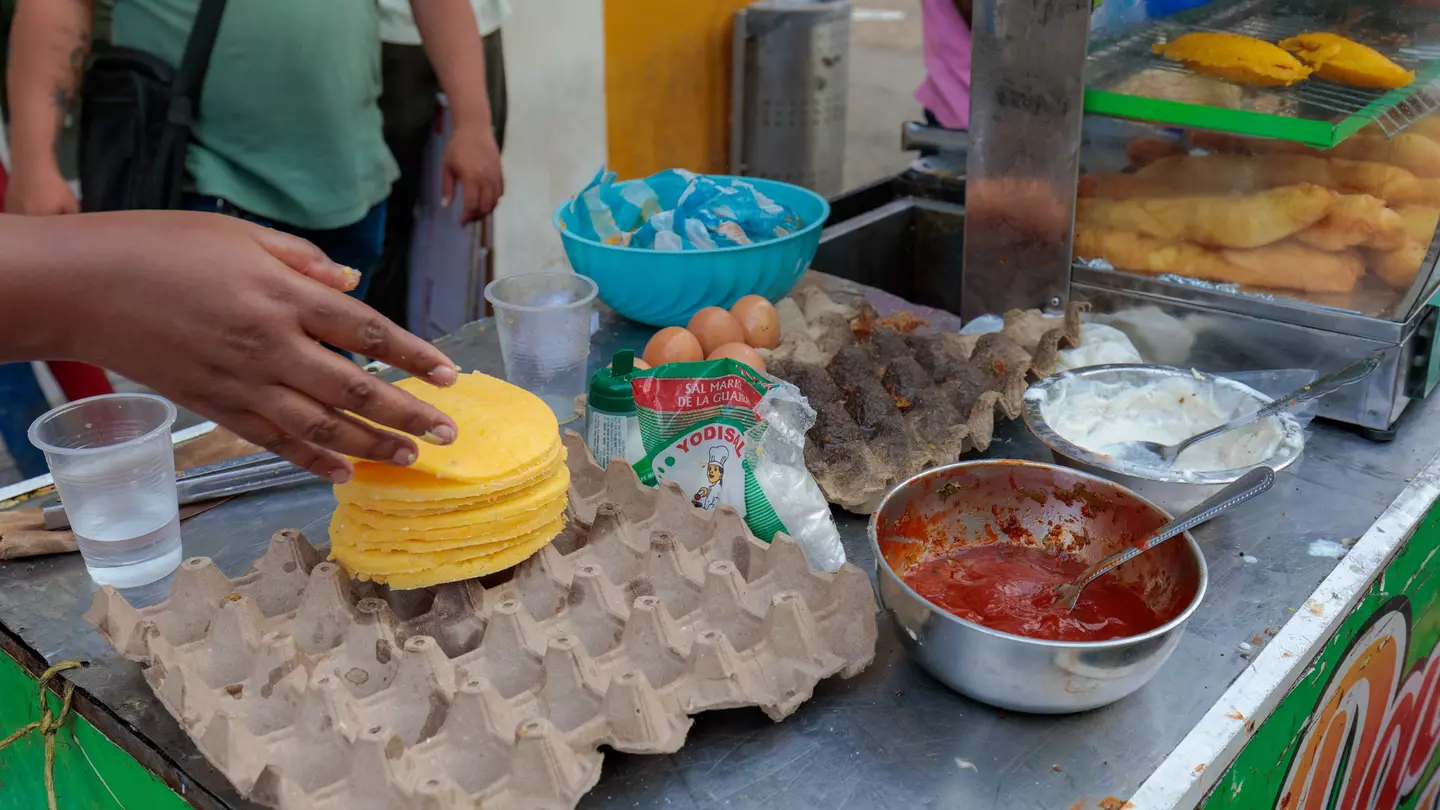 A person holding an empanada in Chile