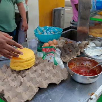 A person holding an empanada in Chile