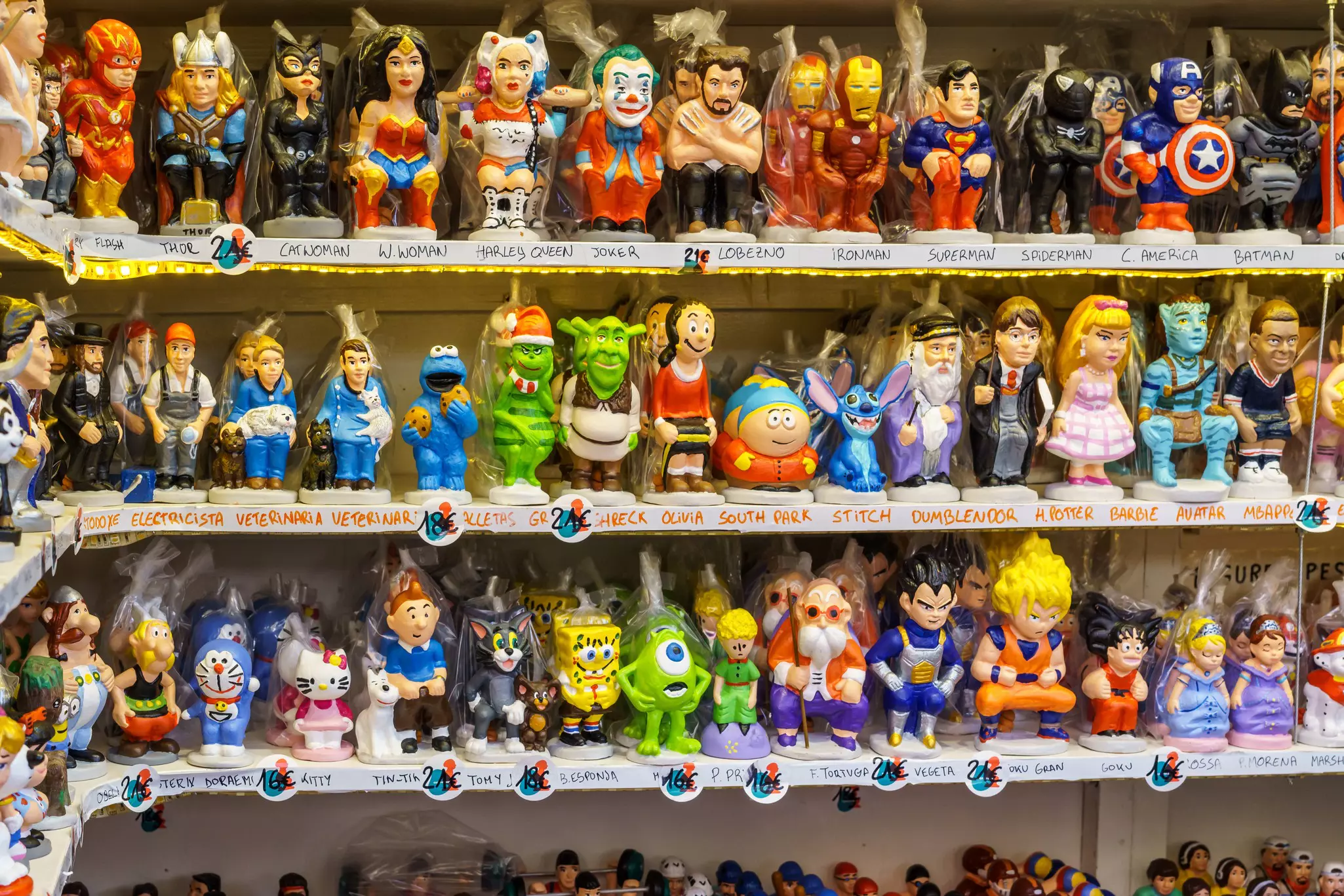 Shelves in a shop packed with small colorful figurines, many in a squatting position as if they are going to the toilet