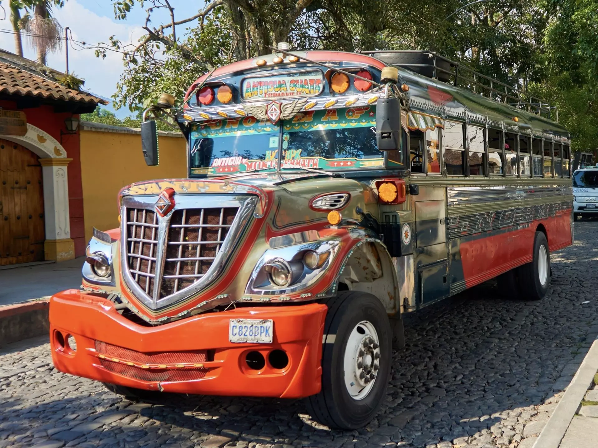 In Guatemala, make like the locals do and catch a reliable if slow (and always decked-out) “chicken bus.” Shutterstock