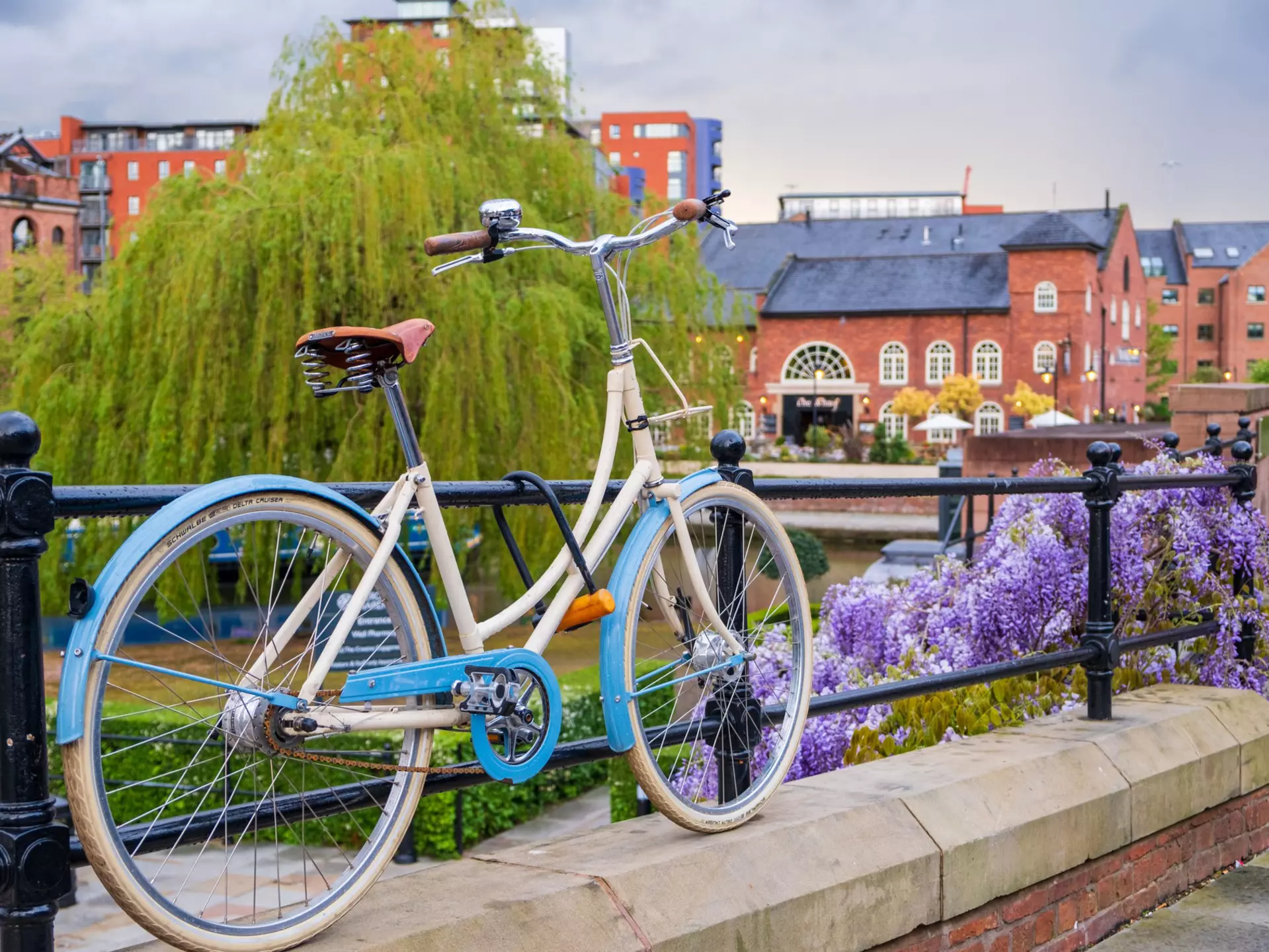 Atmospheric scene  of a parked bicycle at the restored Victorian canal system in Castlefield area of Manchester