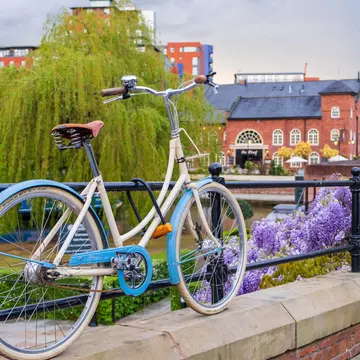 Atmospheric scene  of a parked bicycle at the restored Victorian canal system in Castlefield area of Manchester