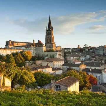 France, Aquitaine Region, Gironde Department, St-Emilion, wine town, town view with Eglise Monolithe church, monring