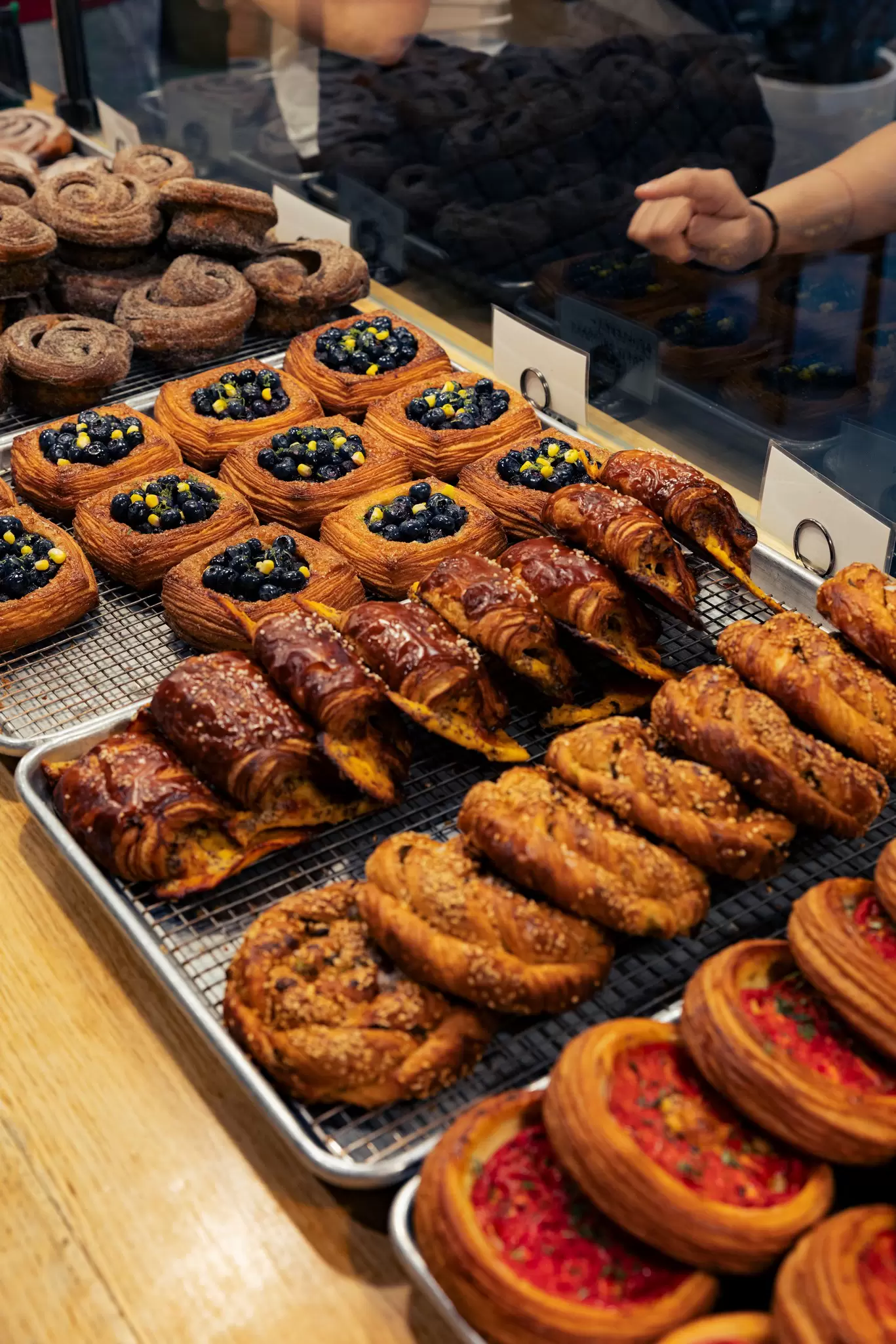 Brooklyn, New York July 5th -- Radio Bakery in Greenpoint, 135 India St, Brooklyn, NY 11222, info@radiobakery.nyc, Nina Subhas ninas@radiobakery.nyc, rows of pastries in display case