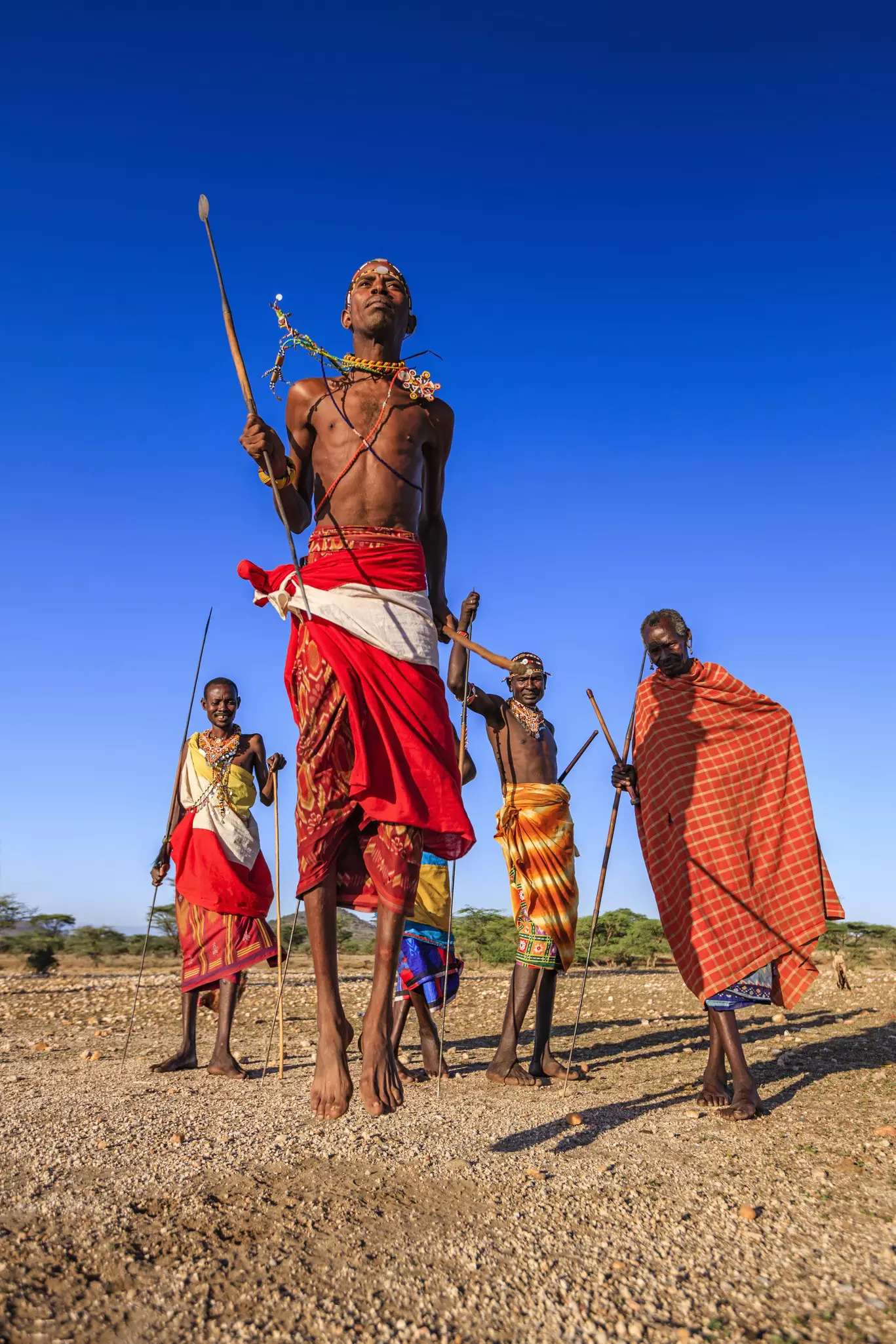 Warrior from Samburu tribe performing traditional jumping dance, Kenya, Africa