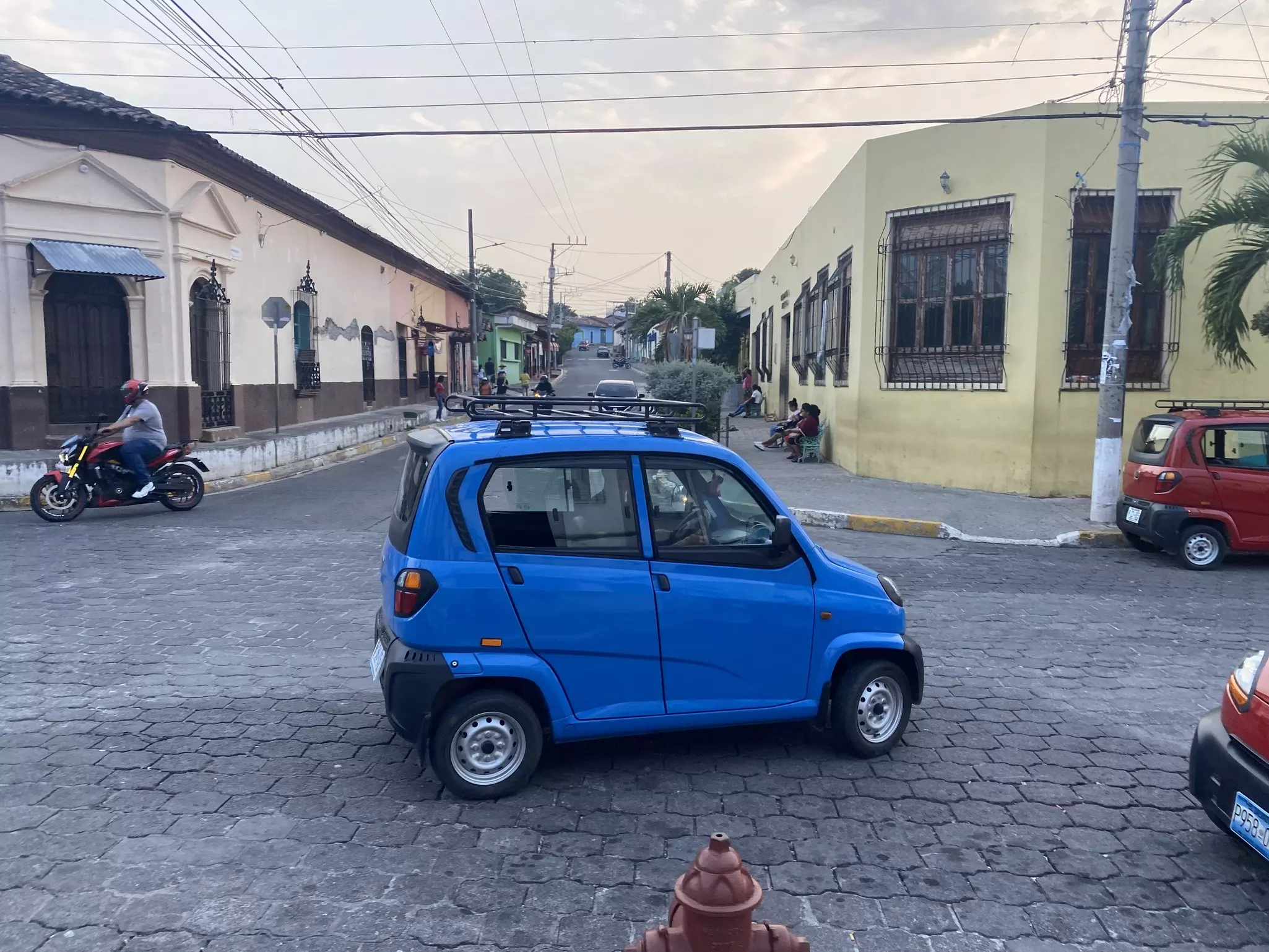 Qute cars serve as taxis in small villages – and bear an uncanny resemblance to the car emoji © Brian Healy