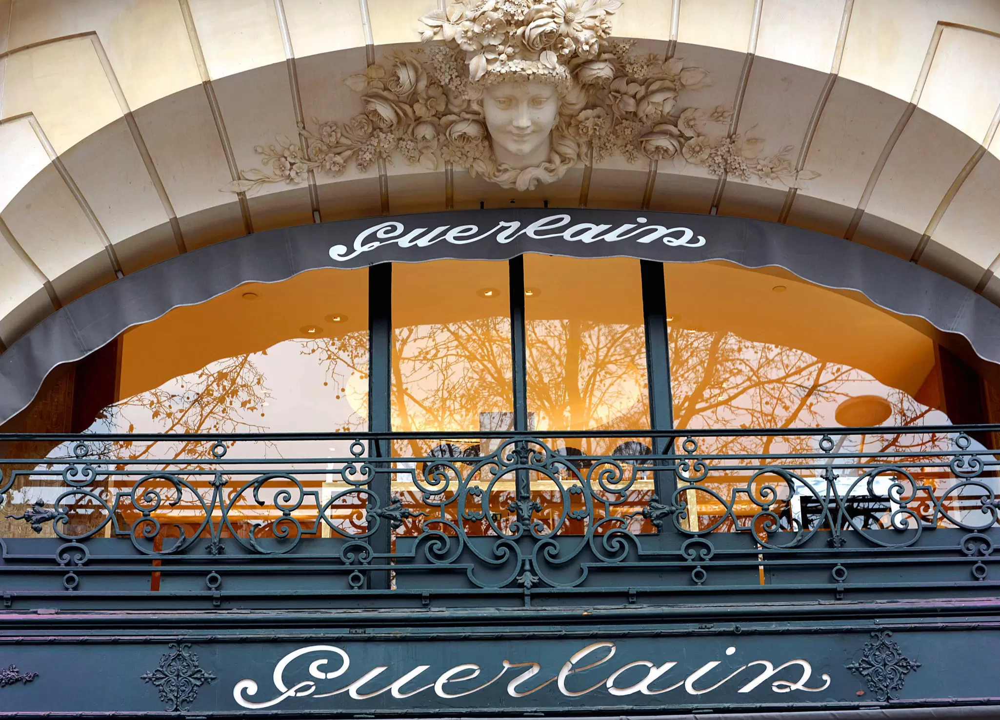 Close-up shot of the sign from the famous shop Guerlain on the Avenue des Champs Élysées.
