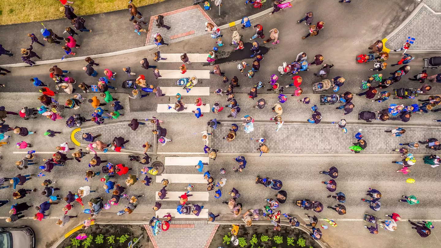 Aerial view, shot by drone: People celebrating Iceland's Independence day in a suburb of Reykjavik, Kopavogur, Iceland