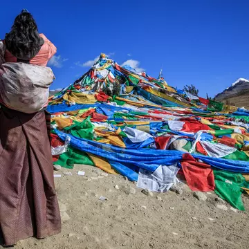A pilgrim makes prayer. Feng Wei Photography / Getty