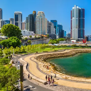 Aerial view of Barangaroo Reserve in Sydney, Australia. People walking with the skyline in the background.