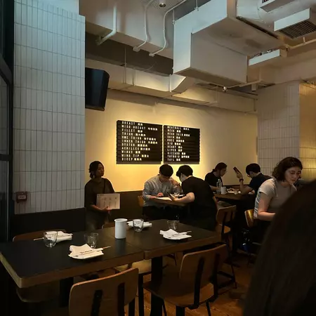 Diners sitting at tables in Yardbird, Hong Kong.